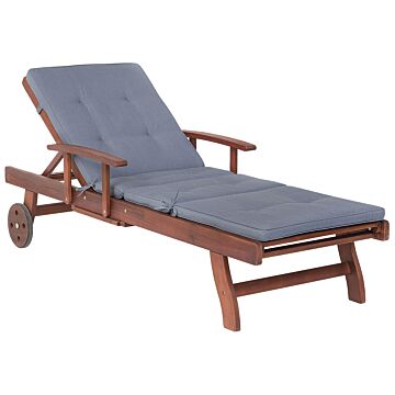 Garden Sun Lounger Light Acacia Wood With Blue Cushion Adjustable Backrest Inbuilt Castors Rustic Style Beliani
