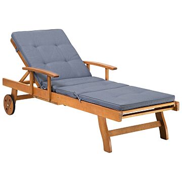Garden Sun Lounger Light Acacia Wood With Blue Cushion Outdoor Weather Resistant Reclining With Wheels Beliani