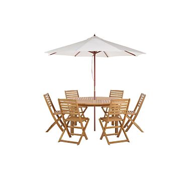 7 Piece Garden Dining Set Light Acacia Wood Round Table And 6 Folding Slatted Chairs Parasol (12 Options) Beliani