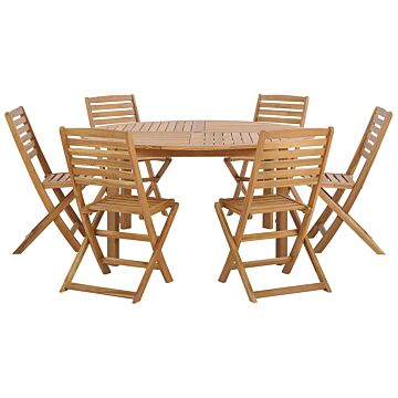 7 Piece Garden Dining Set Light Acacia Wood Round Table And 6 Folding Slatted Chairs Beliani