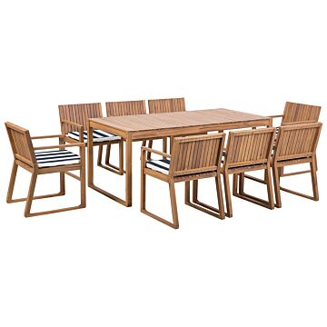 Garden Dining Set Light Acacia Wood Table 8 Chairs With Navy Blue And White Cushions Rustic Style Beliani