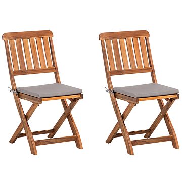 Set Of 2 Garden Chairs Acacia Wood Folding Slatted Back With Grey Seat Pad Cushions Beliani