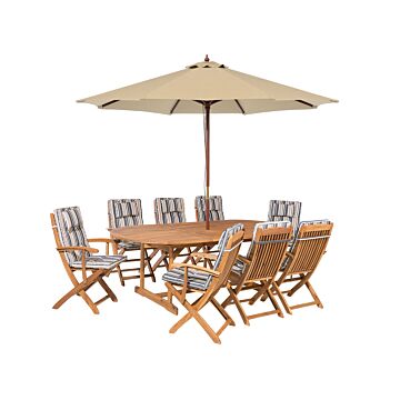 Outdoor Dining Set Light Acacia Wood With Striped Cushions 8 Seater Table Folding Chairs Umbrella Beliani