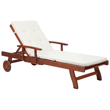 Garden Sun Lounger Light Acacia Wood With Off-white Cushion Adjustable Backrest Inbuilt Castors Rustic Style Beliani